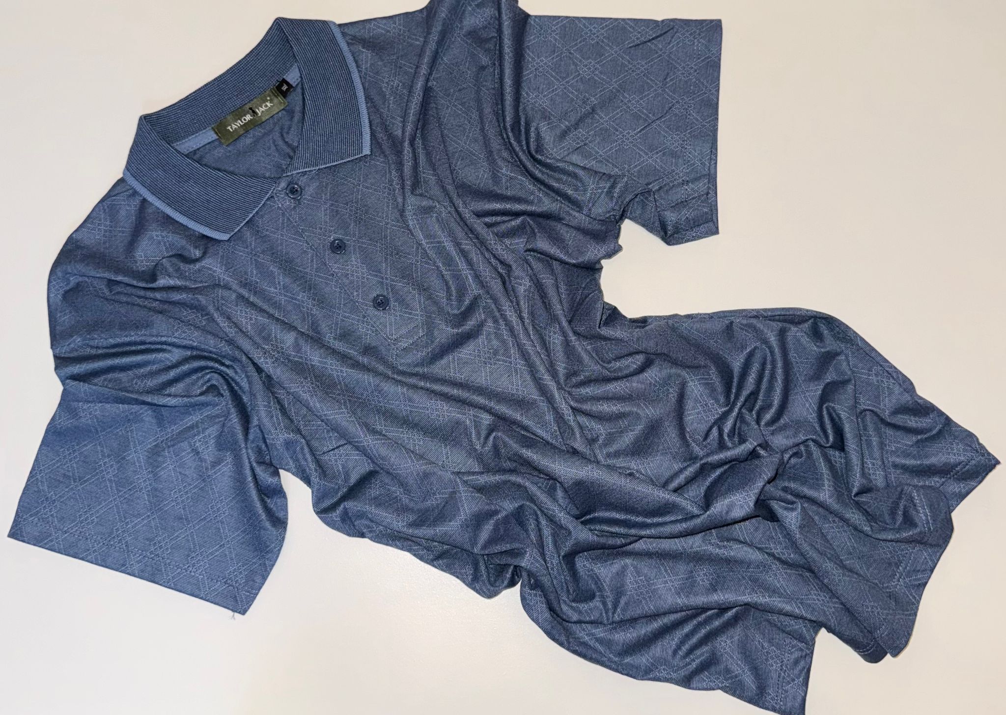 Lichtblauw polo met subtiel patroon