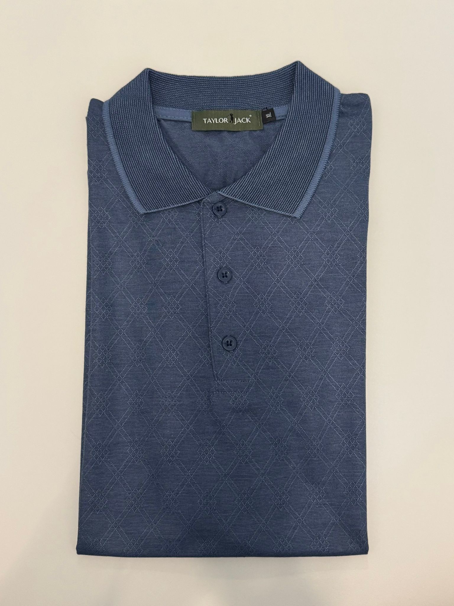 Lichtblauw polo met subtiel patroon