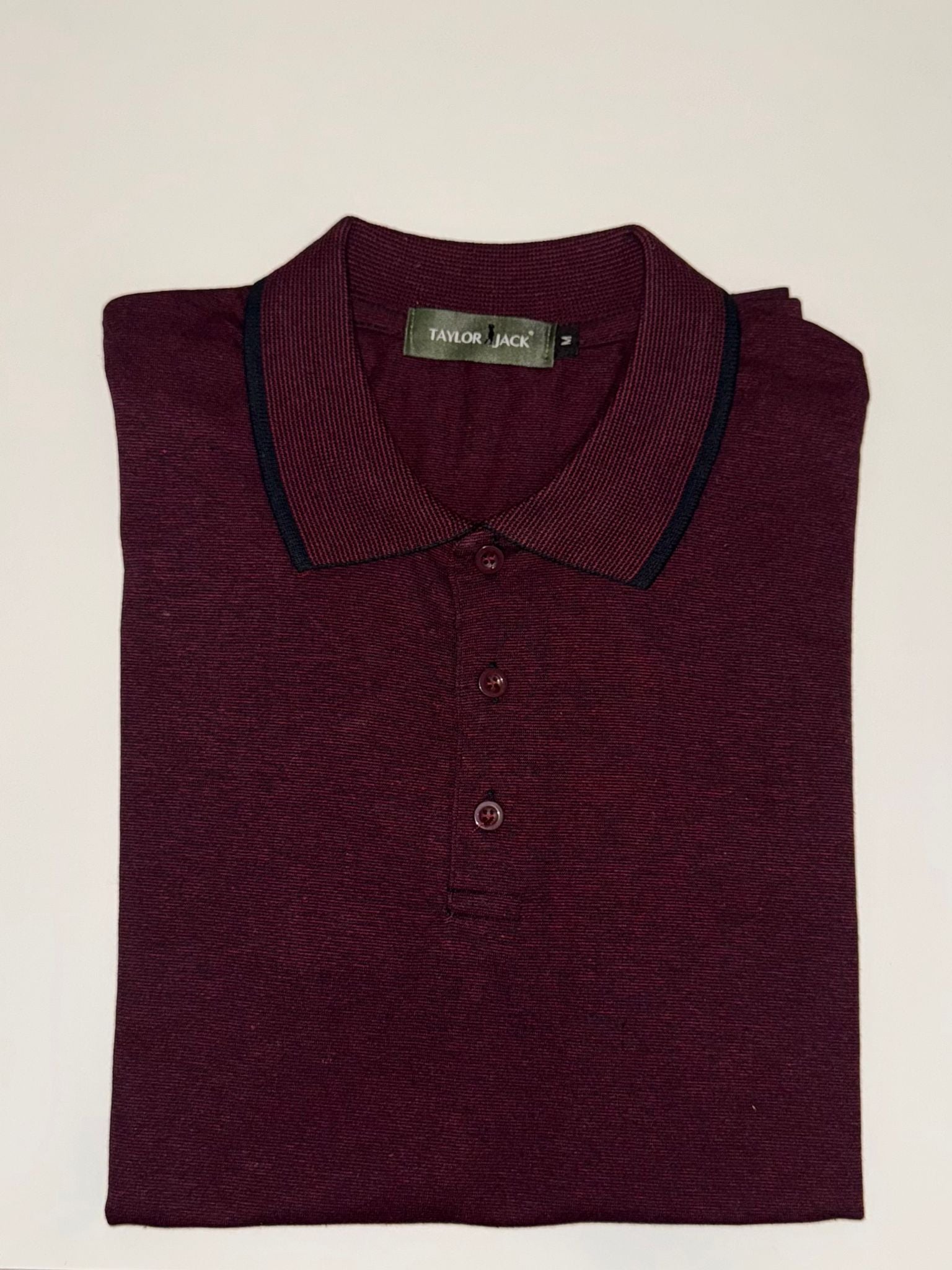 Bordeauxrode polo met subtiel patroon