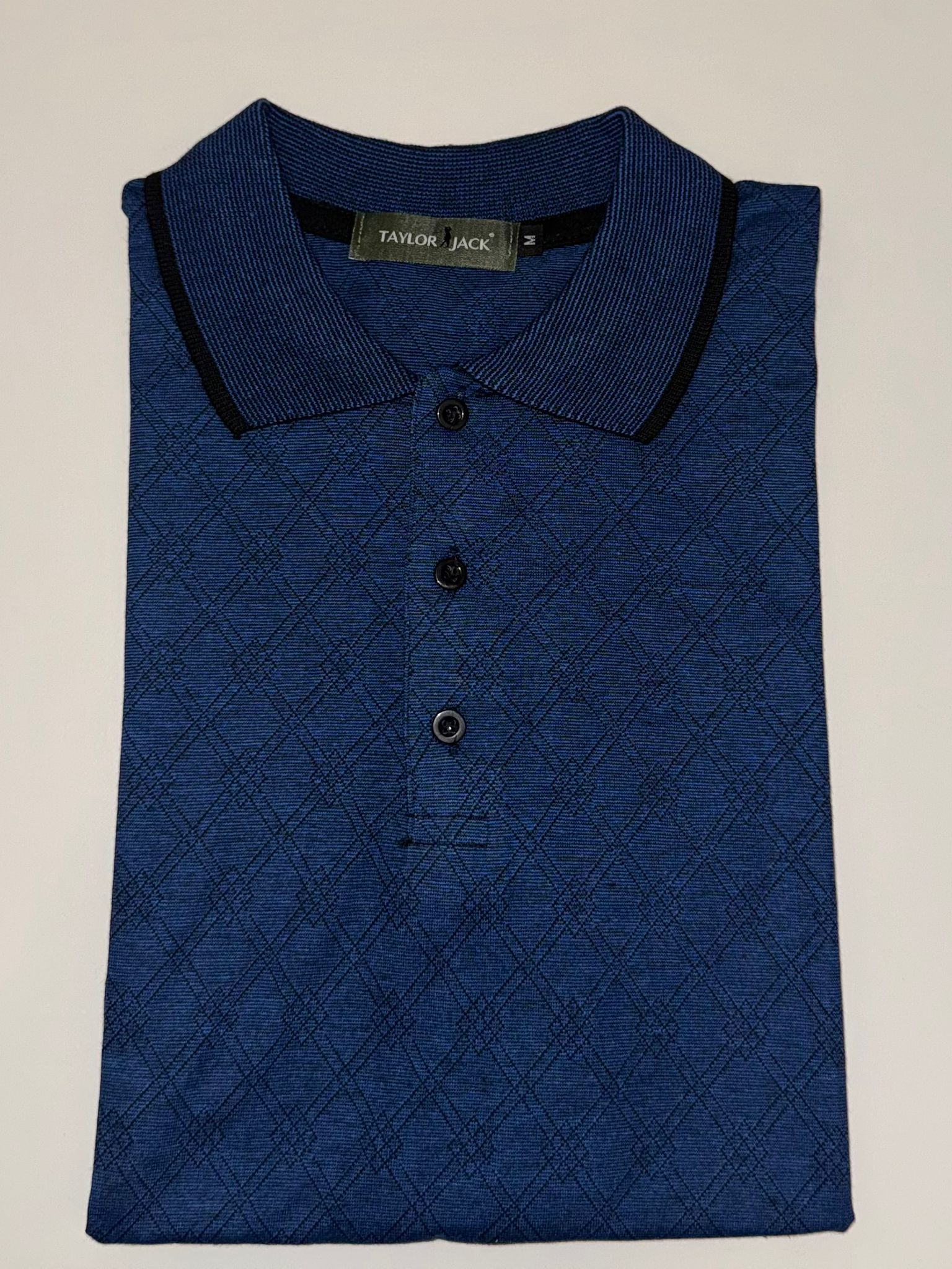 Marineblauwe polo met subtiel patroon